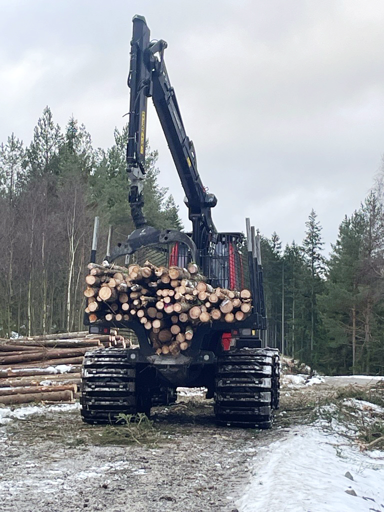 A komatsu forwarderloading timber